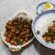 Serving suggestion for mixed stir-fry with tai tow choi: congee with a salted duck egg