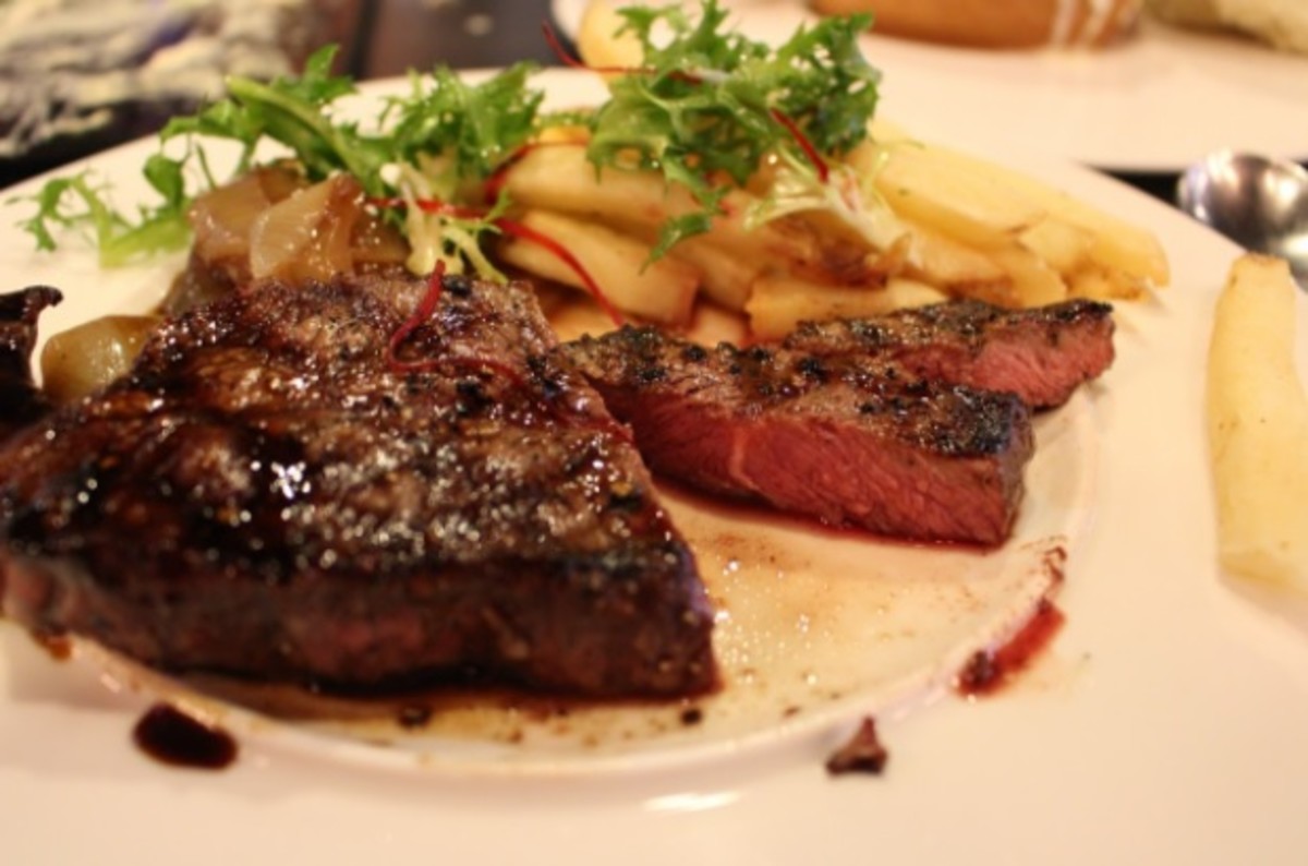 Rare beef steak with fried potatoes. Can you get enough protein without eating meat?